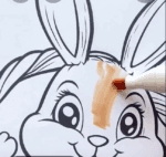 Adorable Easter Bunny Sitting In A Basket Of Colorful Eggs Coloring Page-HowToVideo