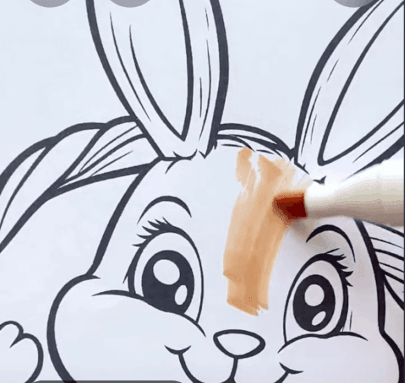 Adorable Easter Bunny Sitting In A Basket Of Colorful Eggs Coloring Page-HowToVideo